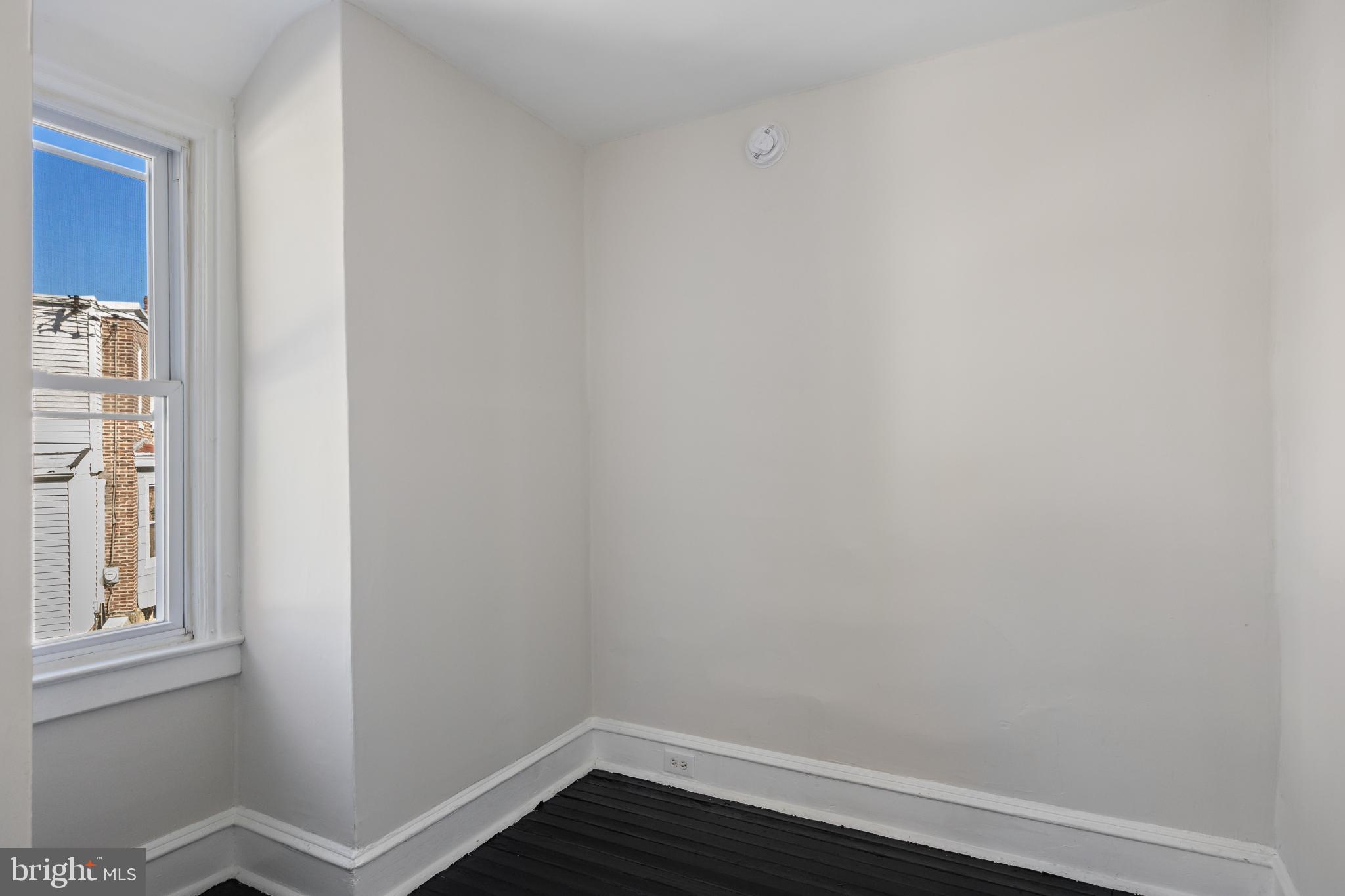 2003 Edgmont Avenue Chester, PA 19013 - Photo 34 of 40 a view of a small space with wooden floor and a window