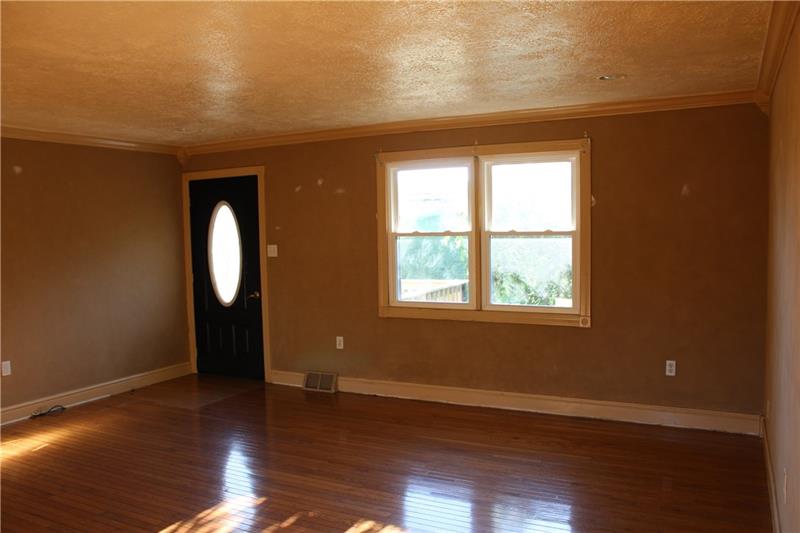 346 Reese Road Washington, PA 15301 - Photo 14 of 25 Enter into your living space from the front porch lined with ornamental trees
