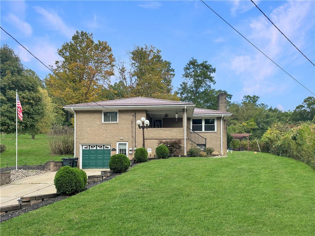916 Atlasburg Road Burgettstown, PA 15021 - Photo 1 of 28 a front view of a house with garden