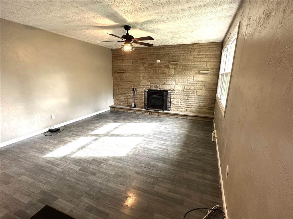 916 Atlasburg Road Burgettstown, PA 15021 - Photo 13 of 28 a view of empty room with wooden floor and fireplace