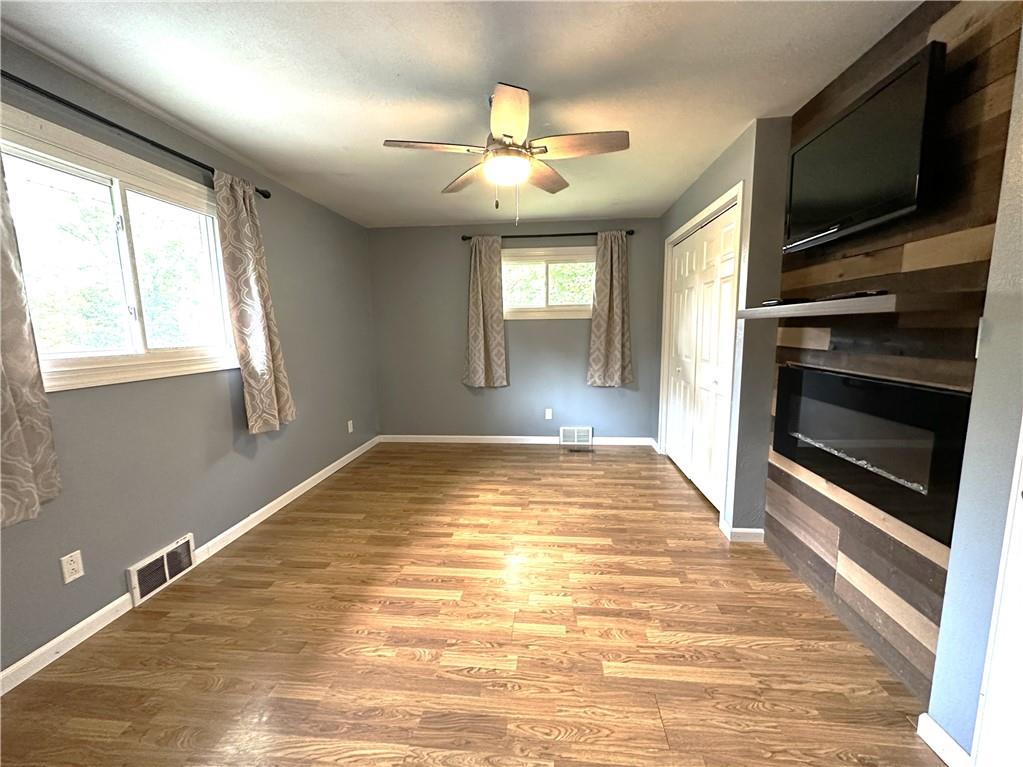 916 Atlasburg Road Burgettstown, PA 15021 - Photo 14 of 28 a view of empty room with wooden floor and kitchen view