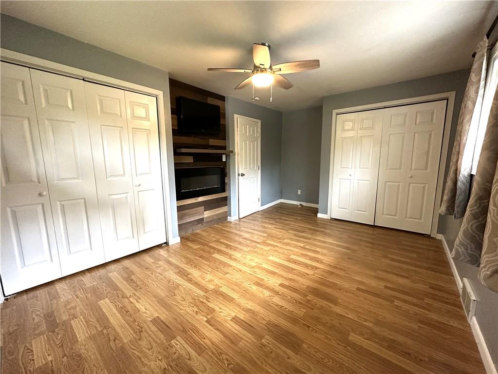 916 Atlasburg Road Burgettstown, PA 15021 - Photo 16 of 28 an empty room with wooden floor cabinet and windows