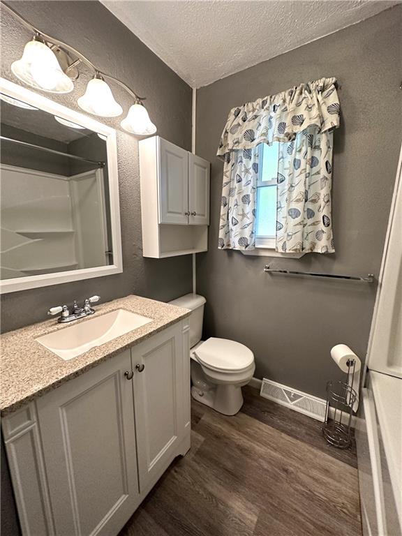 916 Atlasburg Road Burgettstown, PA 15021 - Photo 22 of 28 a bathroom with a granite countertop toilet a sink and mirror