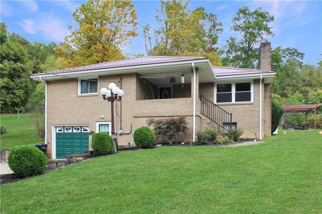 916 Atlasburg Road Burgettstown, PA 15021 - Photo 3 of 28 a view of a house with a yard and plants