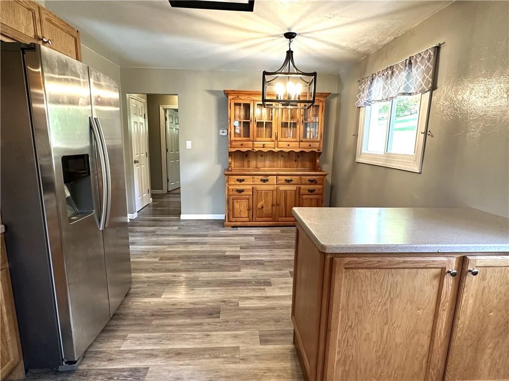916 Atlasburg Road Burgettstown, PA 15021 - Photo 10 of 28 a view of a refrigerator in kitchen and wooden floor