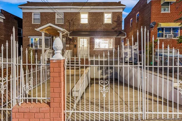a front view of a house with a glass door