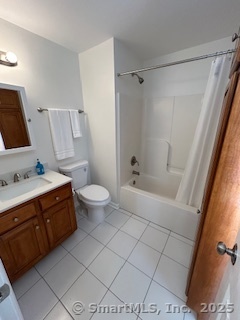 10 Hill Street, Unit 1 New Canaan, CT 06840 - Photo 4 of 10 a bathroom with a sink a toilet and shower
