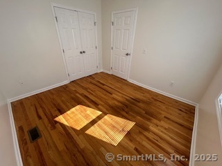 10 Hill Street, Unit 1 New Canaan, CT 06840 - Photo 7 of 10 a view of wooden floor