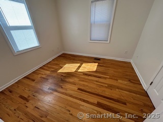 10 Hill Street, Unit 1 New Canaan, CT 06840 - Photo 8 of 10 a view of empty room with window