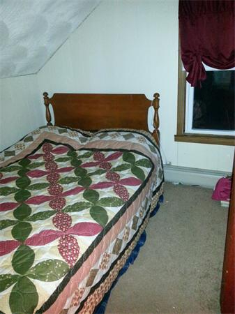 167 Pebble Street Fall River, MA 02721 - Photo 11 of 18 a bedroom with a bed and a painting on the wall