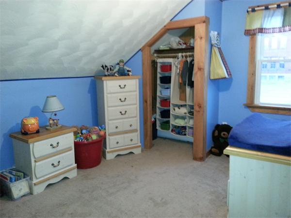167 Pebble Street Fall River, MA 02721 - Photo 8 of 18 a bed room with a bed and a dresser