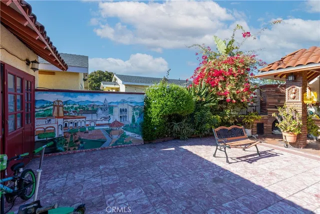 a wooden bench sitting in front of a building