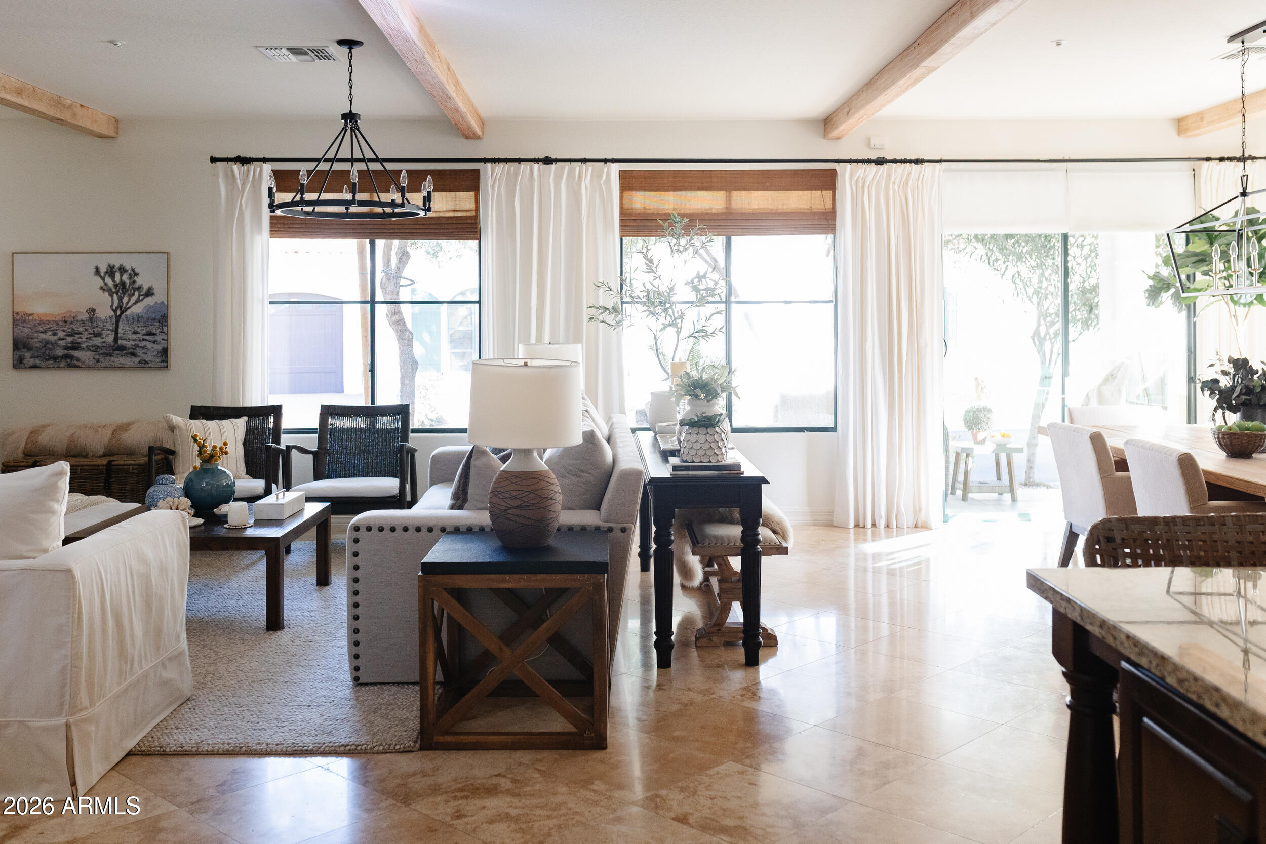 1777 West Ocotillo Road, Unit 29 Chandler, AZ 85248 - Photo 16 of 78 a living room with fireplace furniture and a large window