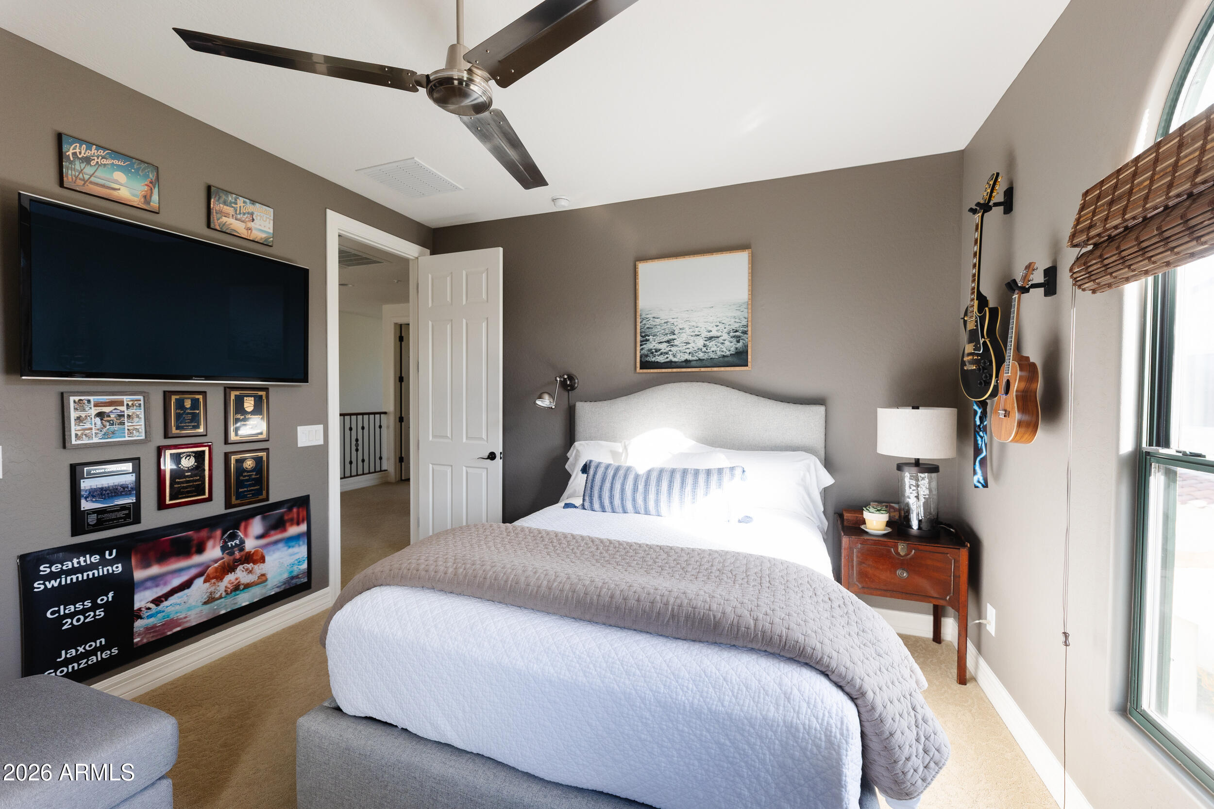 1777 West Ocotillo Road, Unit 29 Chandler, AZ 85248 - Photo 55 of 78 a bedroom with a bed a flat screen tv and a couch