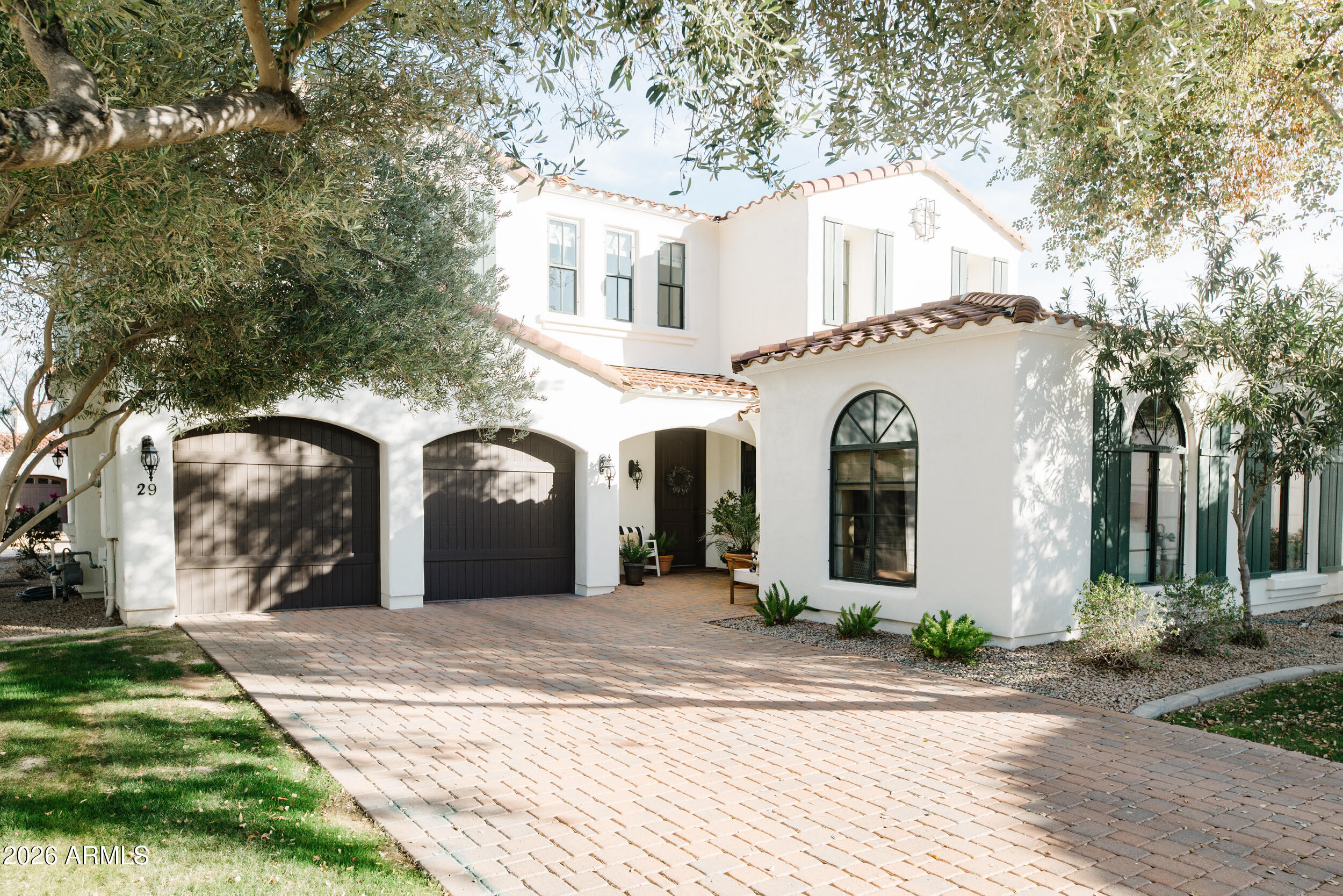1777 West Ocotillo Road, Unit 29 Chandler, AZ 85248 - Photo 6 of 78 a front view of a house with a garden