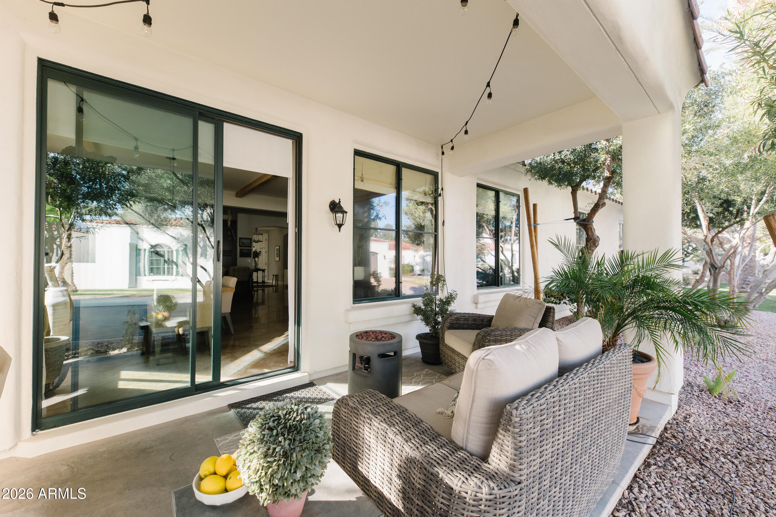 1777 West Ocotillo Road, Unit 29 Chandler, AZ 85248 - Photo 61 of 78 a living room with furniture and a floor to ceiling window