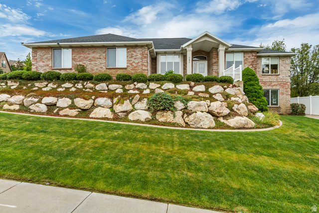 298 North Canyon Road Bountiful, UT 84010 - Photo 2 of 57 Brick facade residence with a columned portico entry