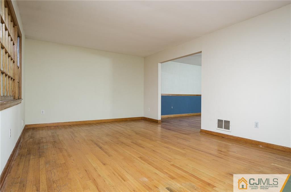 21 Station Road Cranbury, NJ 08512 - Photo 3 of 25 a view of an empty room and wooden floor