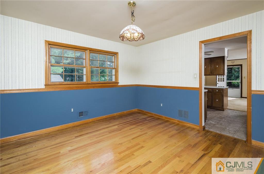 21 Station Road Cranbury, NJ 08512 - Photo 5 of 25 a view of an empty room with a window