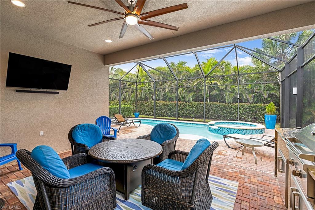 13628 Mandarin Circle Naples, FL 34109 - Photo 13 of 48 a outdoor dining space with furniture and outdoor view