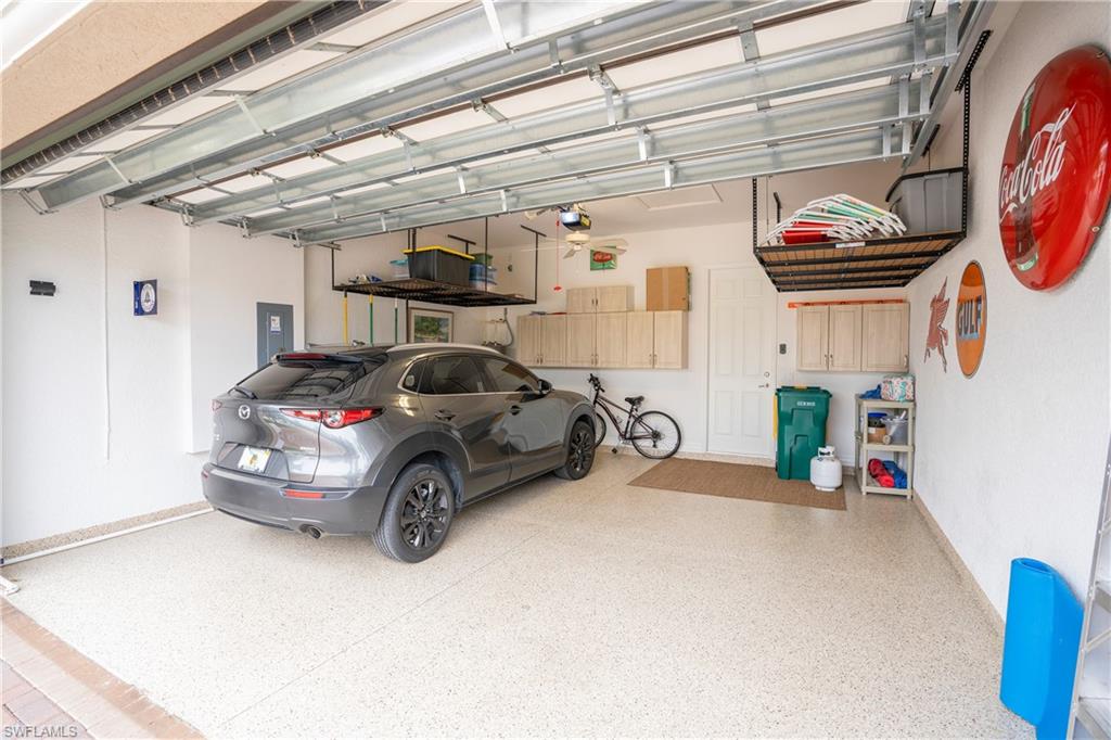 13628 Mandarin Circle Naples, FL 34109 - Photo 32 of 48 a car parked in front of a building