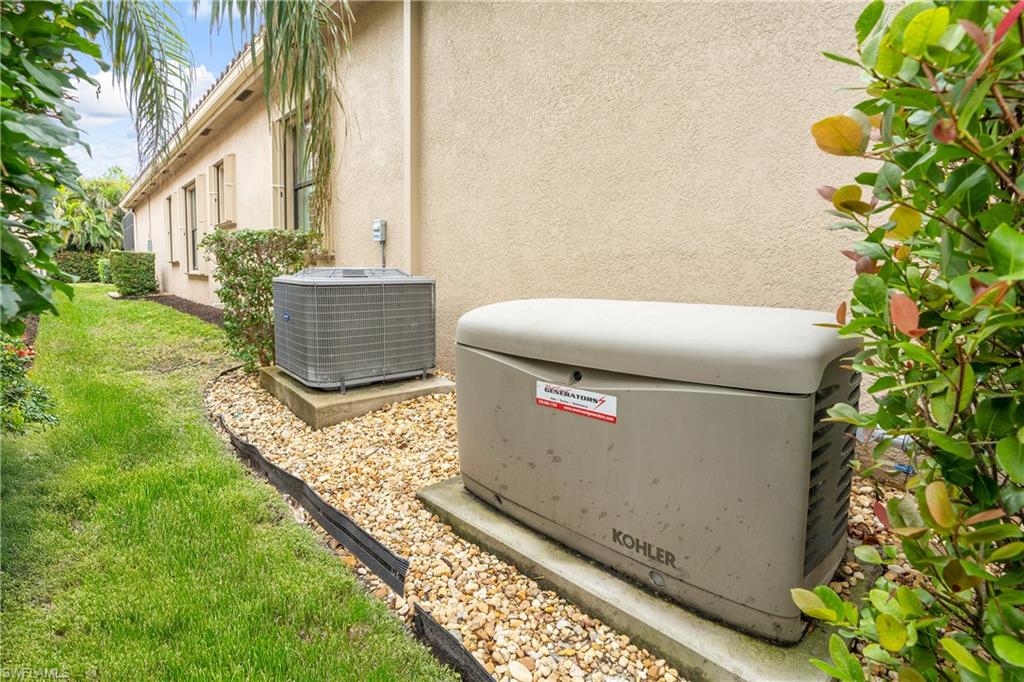 13628 Mandarin Circle Naples, FL 34109 - Photo 33 of 48 a view of a bathroom with sink and garden