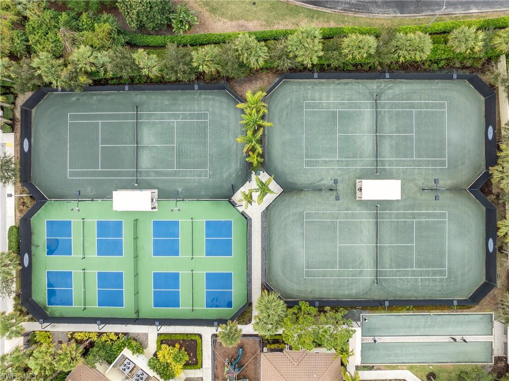 13628 Mandarin Circle Naples, FL 34109 - Photo 35 of 48 a view of a brick building with large windows