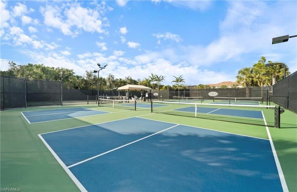 13628 Mandarin Circle Naples, FL 34109 - Photo 37 of 48 a view of a tennis court
