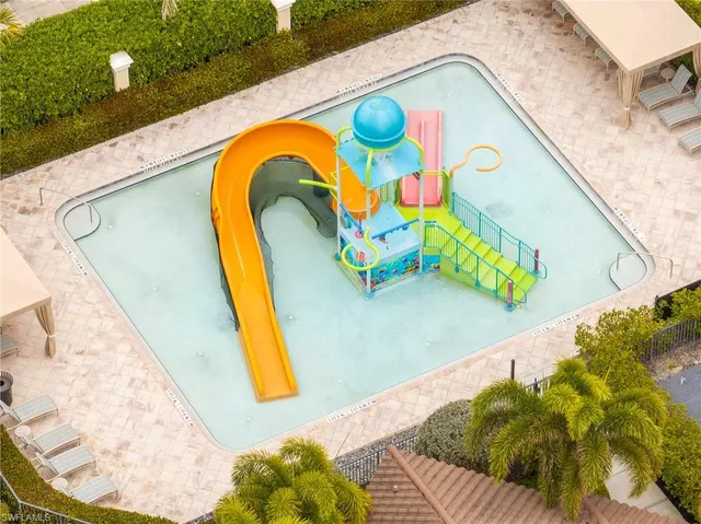 a view of a garden with lawn chairs