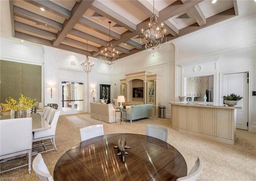 13628 Mandarin Circle Naples, FL 34109 - Photo 41 of 48 a living room with furniture and a chandelier