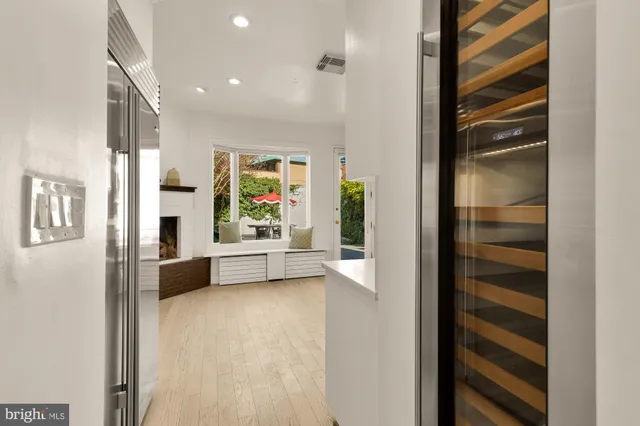a kitchen with stainless steel appliances a stove and a more cabinets