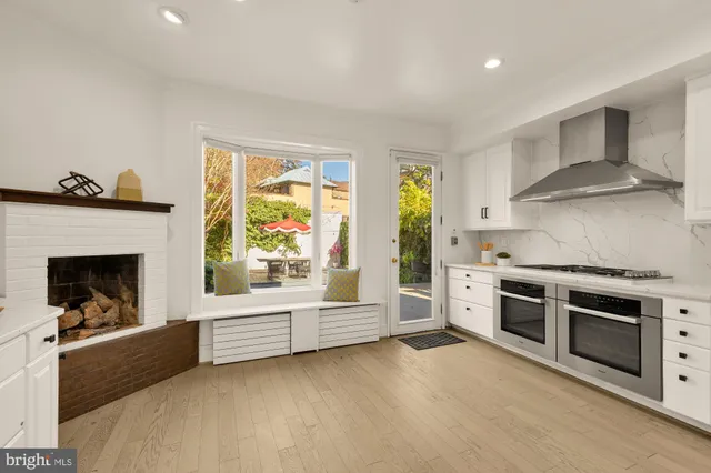 a kitchen with stainless steel appliances a stove a sink and a refrigerator