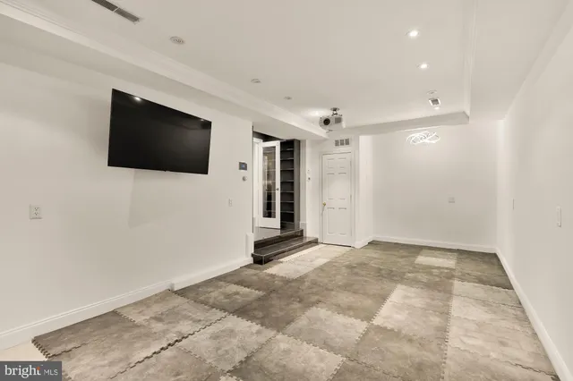 a patio with wooden floor and city view