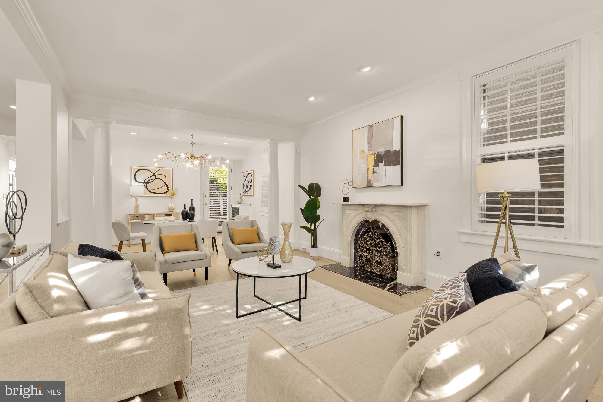 3249 P Street Northwest Washington, DC 20007 - Photo 5 of 59 a living room with furniture a fireplace and floor to ceiling windows