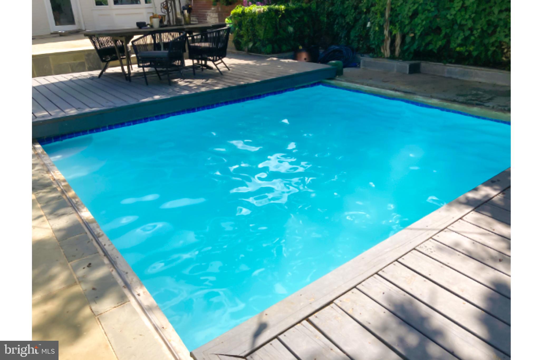 3249 P Street Northwest Washington, DC 20007 - Photo 53 of 59 a view of a swimming pool with a patio