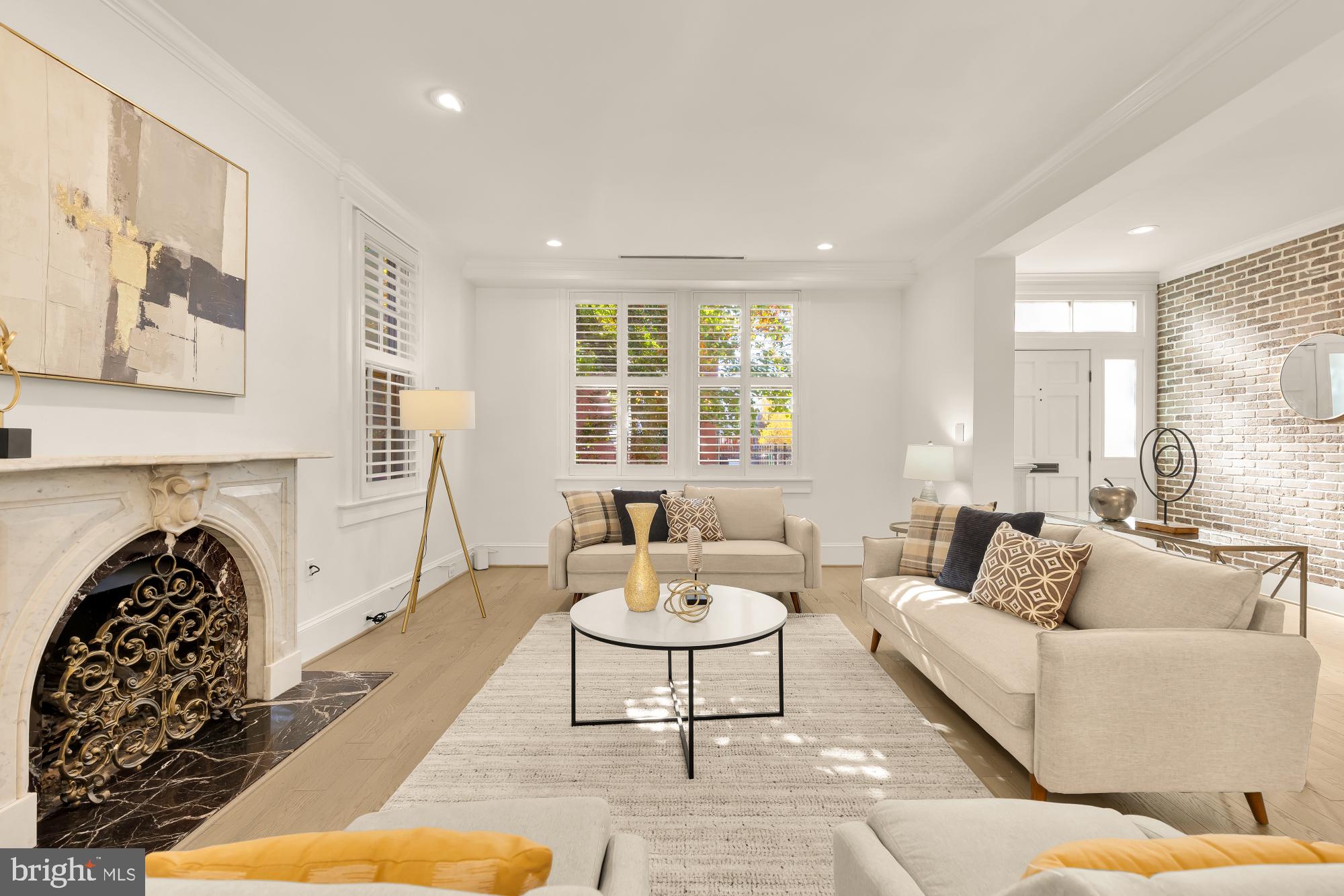 3249 P Street Northwest Washington, DC 20007 - Photo 8 of 59 a living room with furniture and a fireplace
