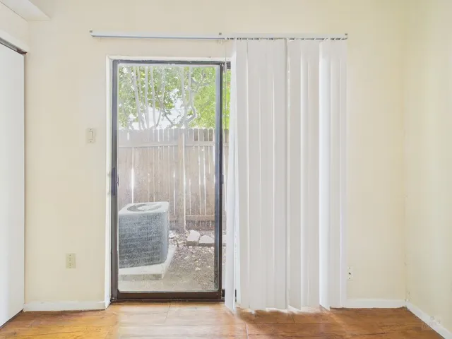 a view of a bathroom with a glass door