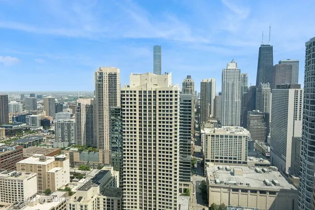 a view of city with tall buildings
