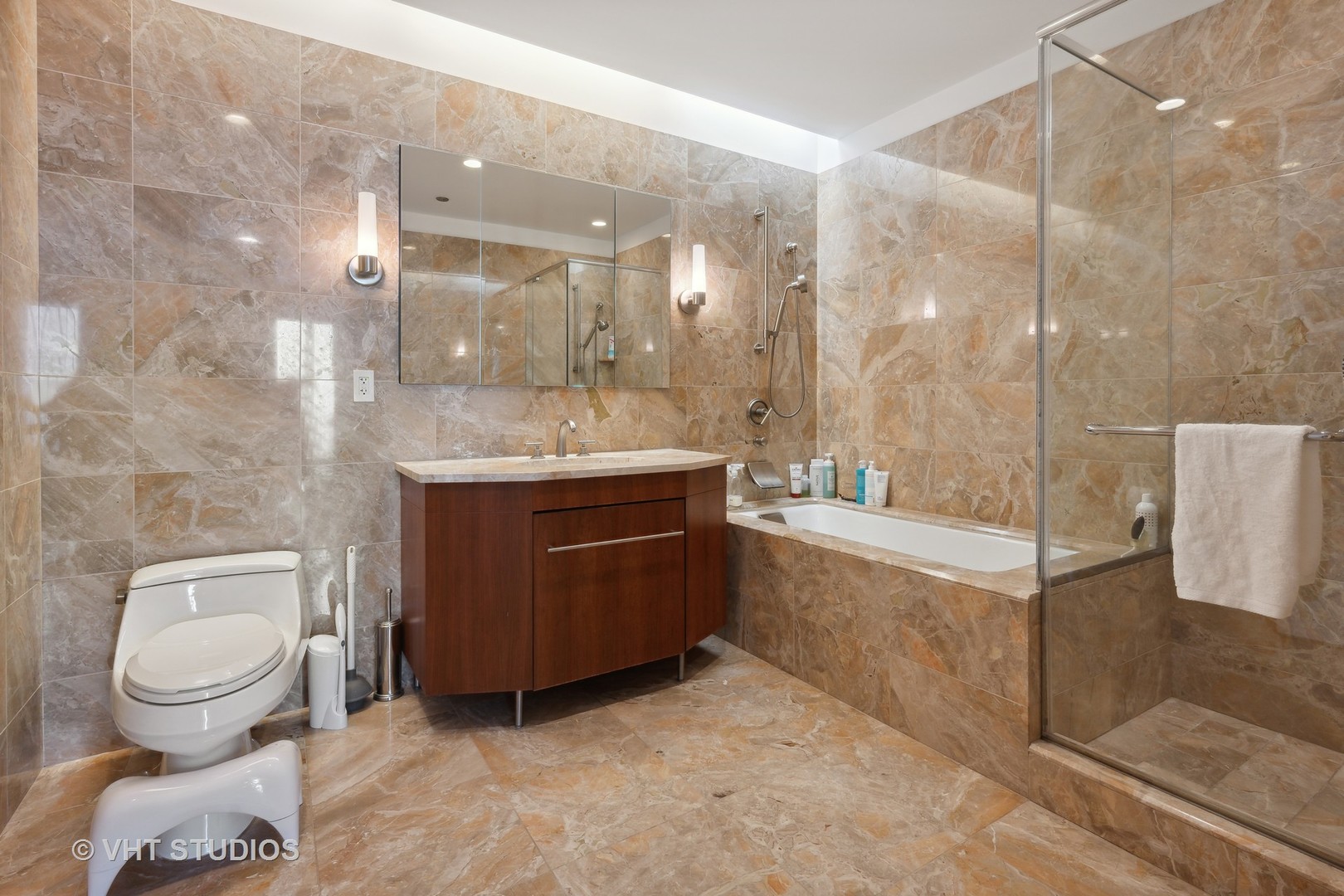401 North Wabash Avenue, Unit 30E Chicago, IL 60611 - Photo 9 of 13 a bathroom with a granite countertop sink a toilet and bathtub