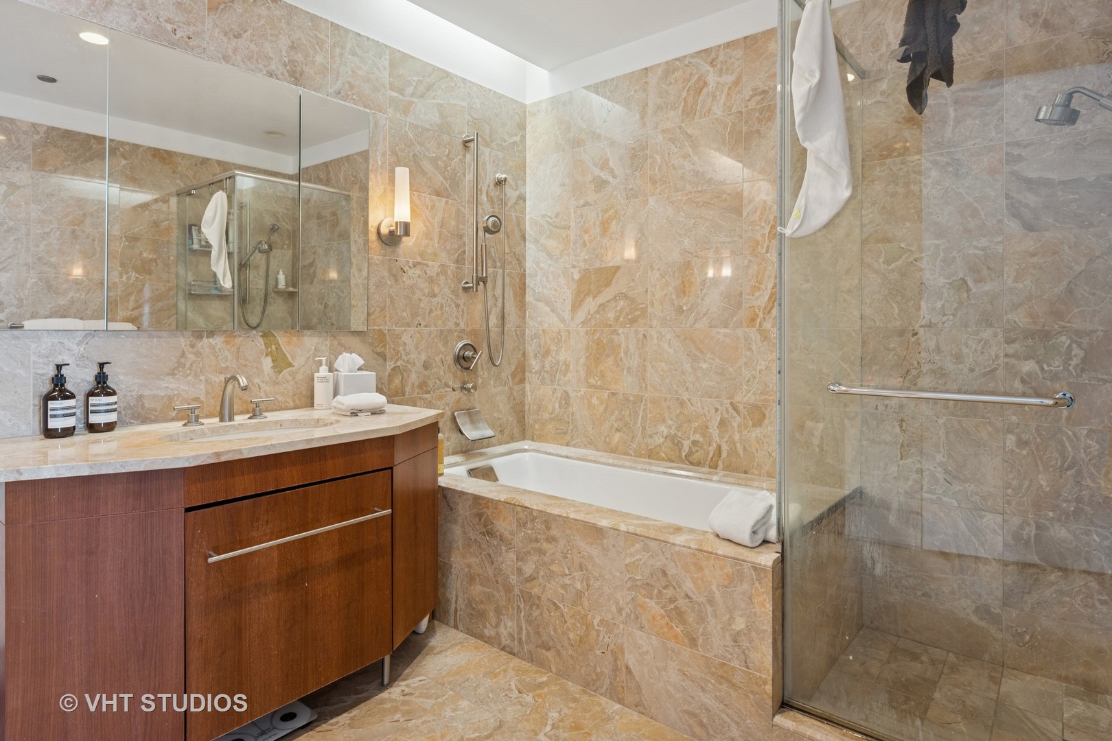 401 North Wabash Avenue, Unit 30E Chicago, IL 60611 - Photo 10 of 13 a bathroom with a shower sink vanity and mirror