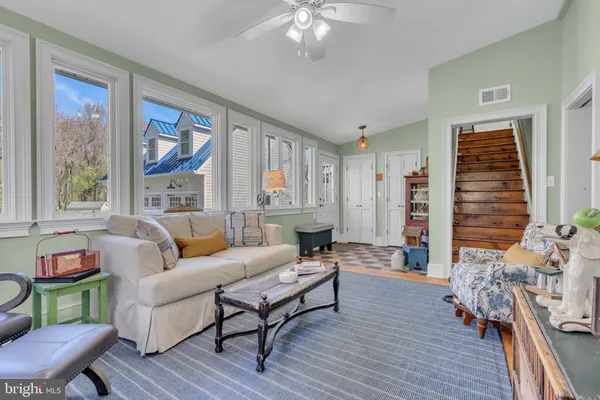 view of a hallway with wooden floor and entryway