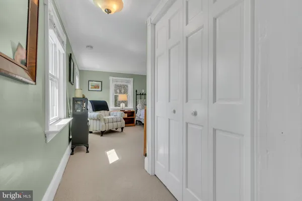 a front view of a house with a yard table and chairs