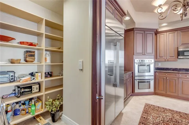 a kitchen with sink refrigerator and window