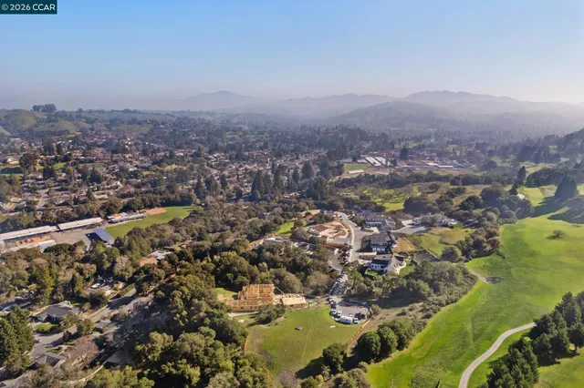 a view of a city and mountains ocean view