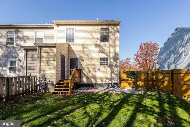 a view of a house with wooden deck
