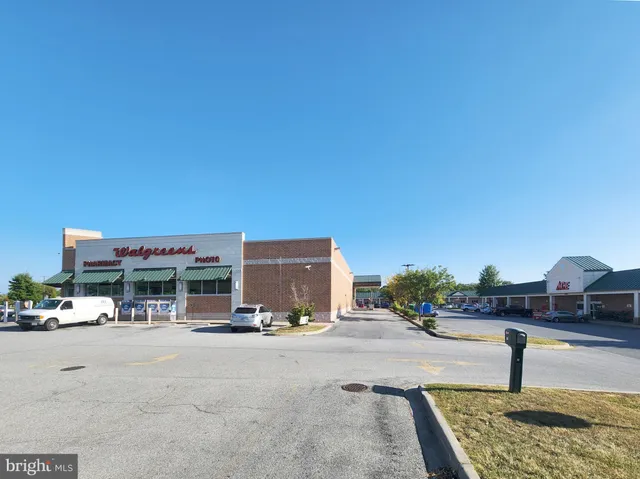 a sign that is sitting in front of flowers