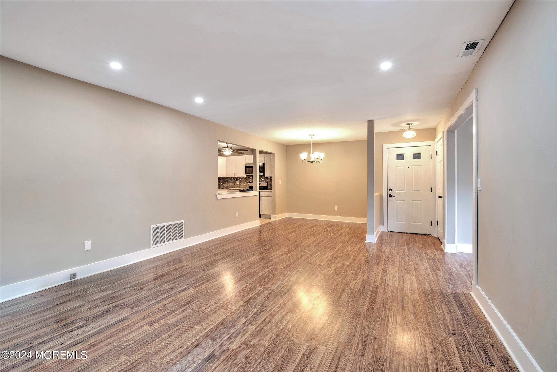509 Harding Road, Unit 1 Freehold, NJ 07728 - Photo 7 of 43 a view of empty room with wooden floor