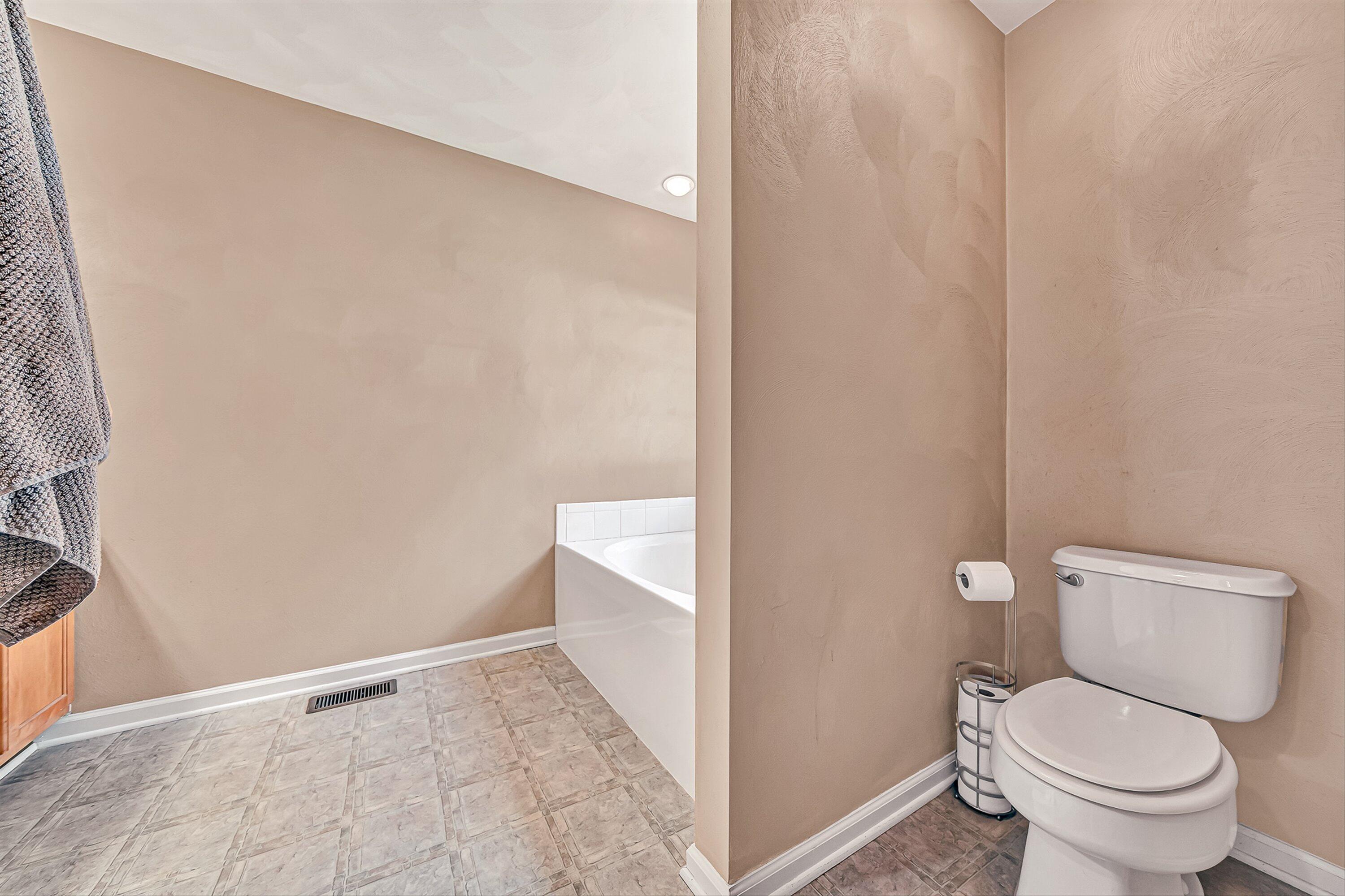 4219 Daugherty Road Salem, VA 24153 - Photo 17 of 28 a white toilet sitting next to a shower