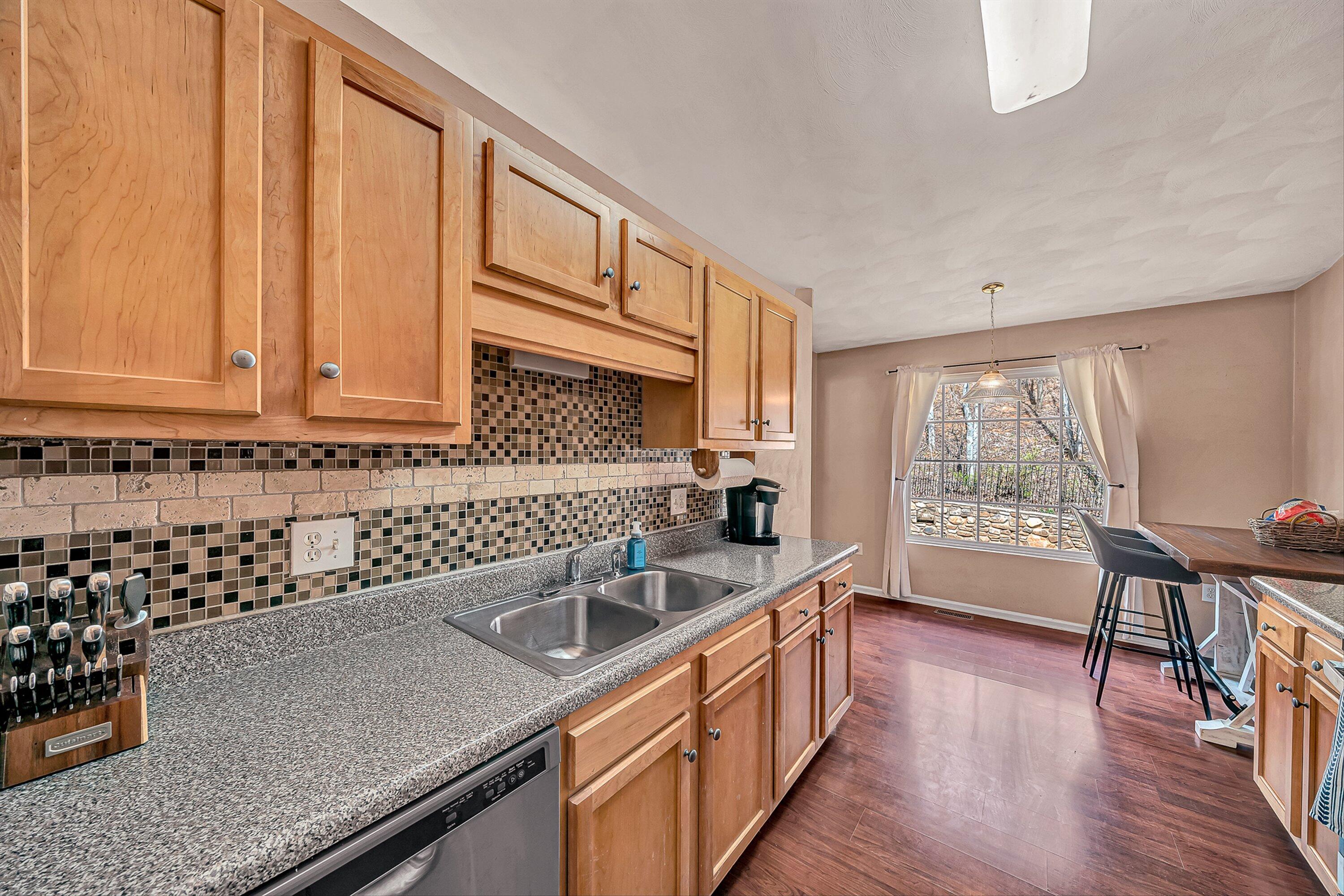 4219 Daugherty Road Salem, VA 24153 - Photo 6 of 28 a kitchen with sink cabinets and wooden floor