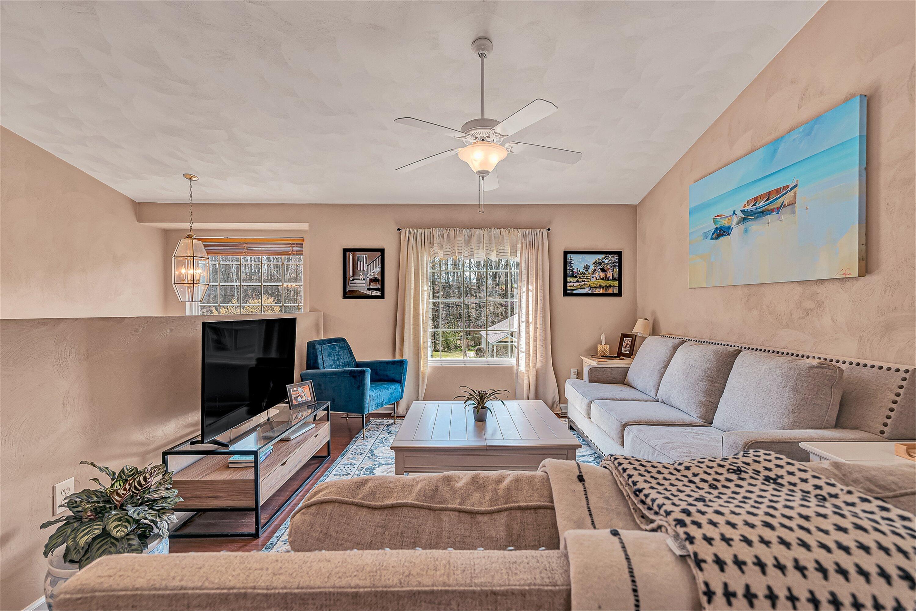 4219 Daugherty Road Salem, VA 24153 - Photo 7 of 28 a living room with furniture a large window and a chandelier